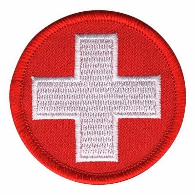 Tygmärke Runt Rött med Vitt Kors